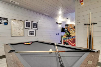 pool table at grinning bear retreat which is one of our big cabins in the Smokies